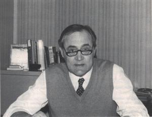 A black and white portrait of David Whitaker