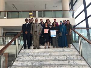 Delegates of the Arab World Meeting pose on the steps of the Library