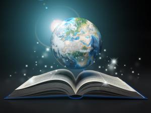 An image of the Planet Earth above an open book