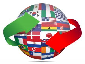 Picture of the globe covered in national flags with arrows to imply spinning