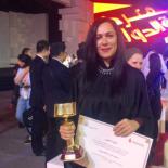 Ms. Basema Younes, United Arab Emirates ISBN Agency Basema Younes holding her award