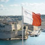 Maltese flag flying from upper Barrakka gardens in Valletta.